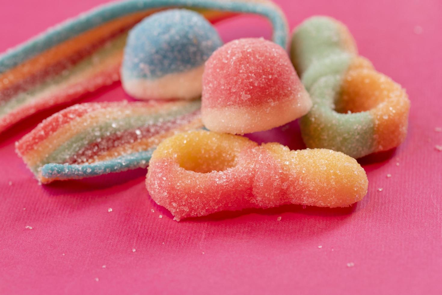 candies on pink background. Selective focus. photo