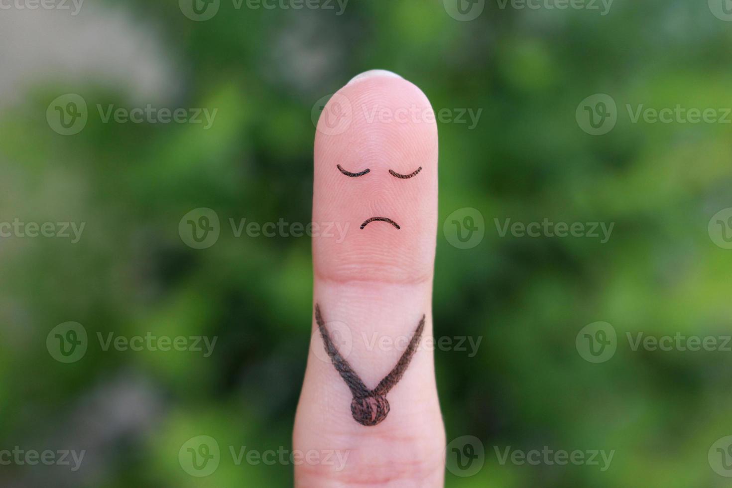 Finger art of a lonely sad man. photo