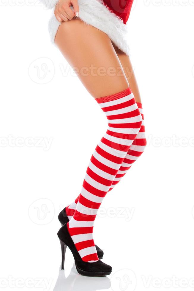 Woman with long legs and stockings over isolated background photo