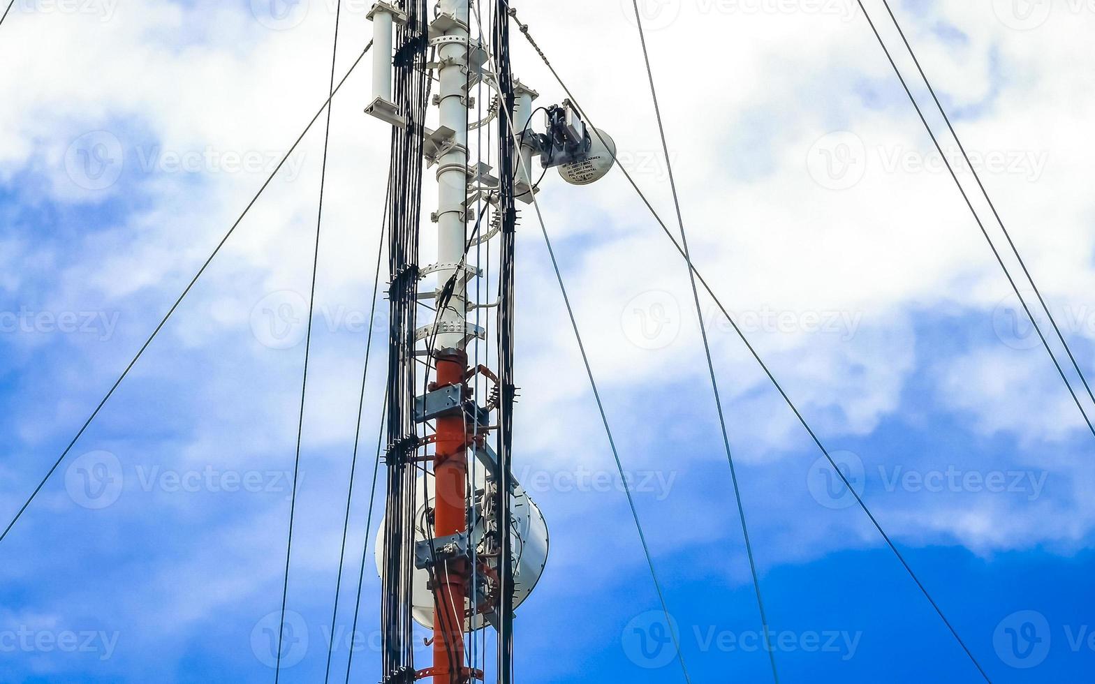Red white 5G tower radiation in Playa del Carmen Mexico. photo