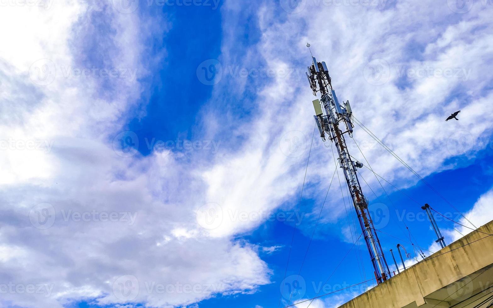 Red white 5G tower radiation in Playa del Carmen Mexico. photo