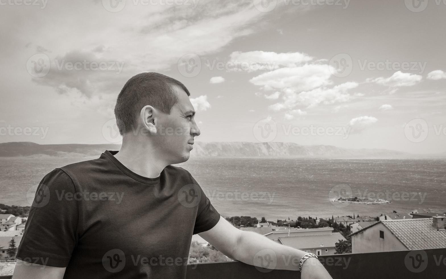 Young male model at Mediterranean landscape in Novi Vinodolski Croatia. photo