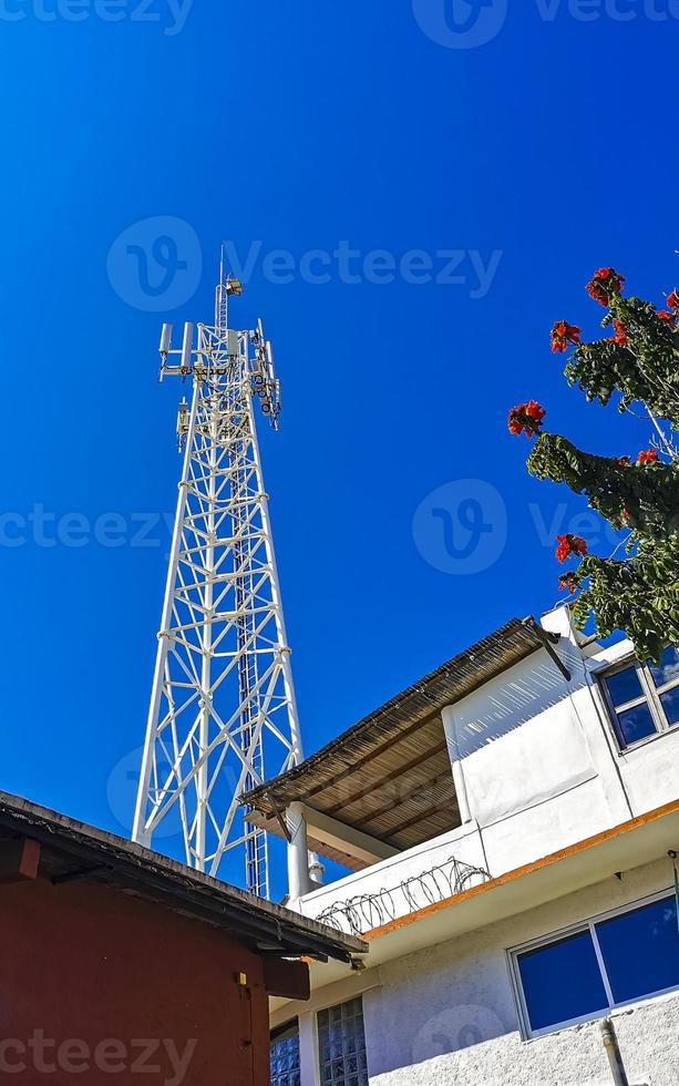 Red white 5G tower radiation in Puerto Escondido Mexico. photo