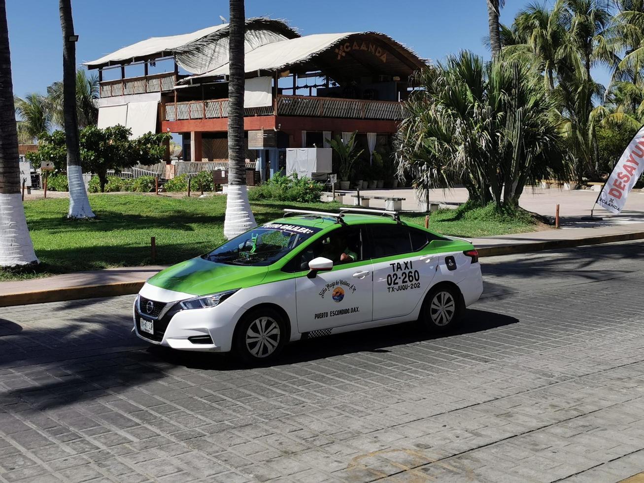 Puerto Escondido Oaxaca Mexico 2023  Green colorful taxi cab car in Puerto Escondido Mexico. photo