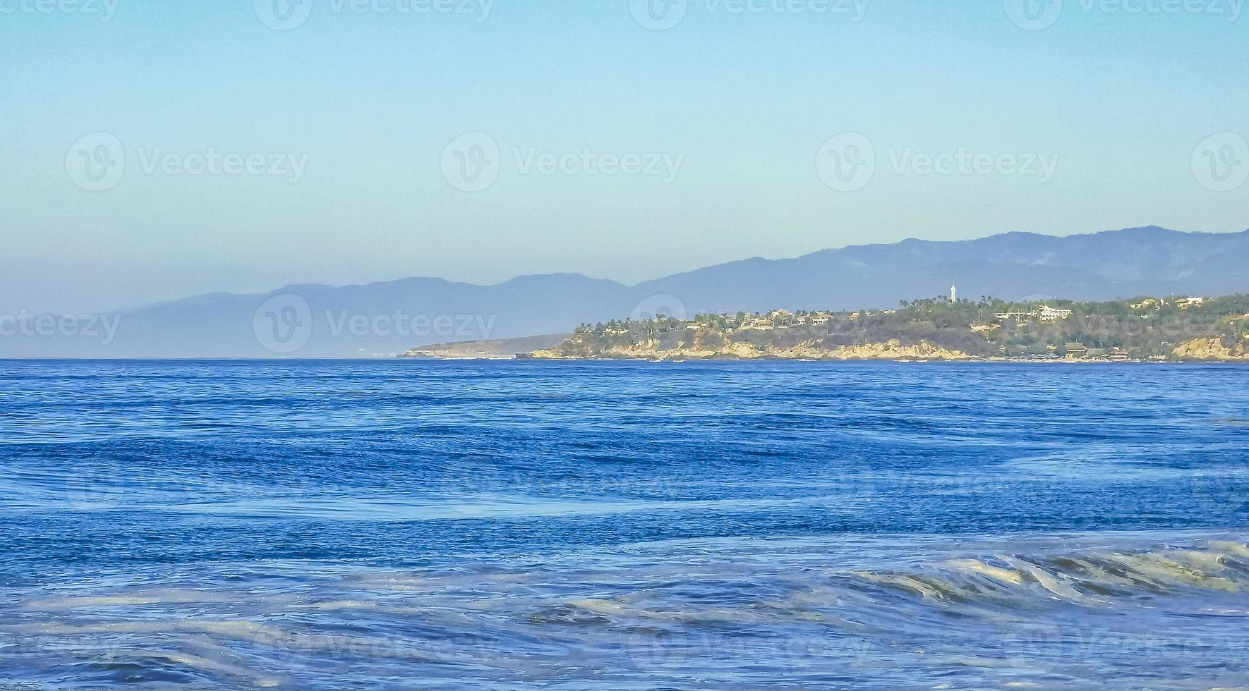 Beach sand blue water huge surfer waves Puerto Escondido Mexico. photo