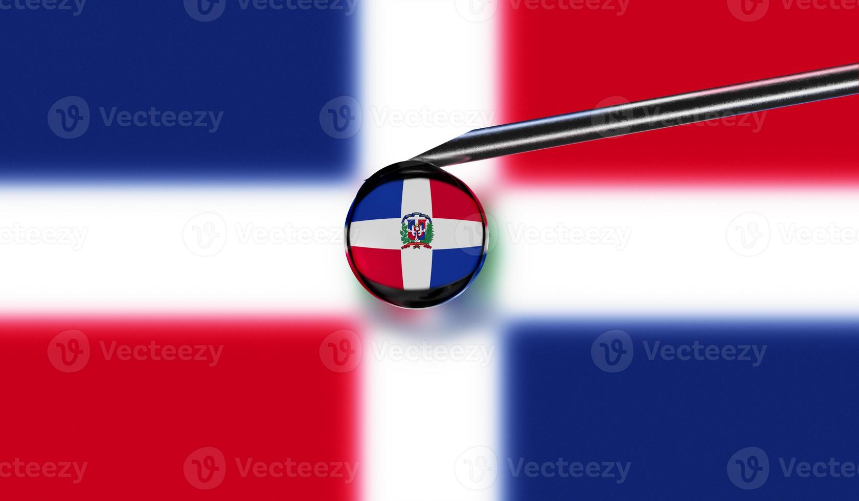 Vaccine syringe with drop on needle against national flag of Dominican Republic background. Medical concept vaccination. Coronavirus Sars-Cov-2 pandemic protection. National safety idea. photo