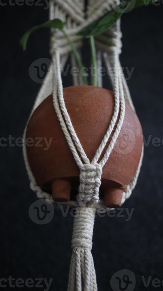 macrame with a plant on the aesthetic wall photo