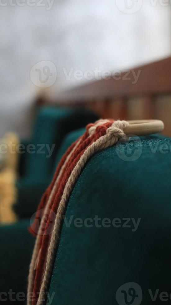 Close up of red and white rope on blue background. Selective focus. photo