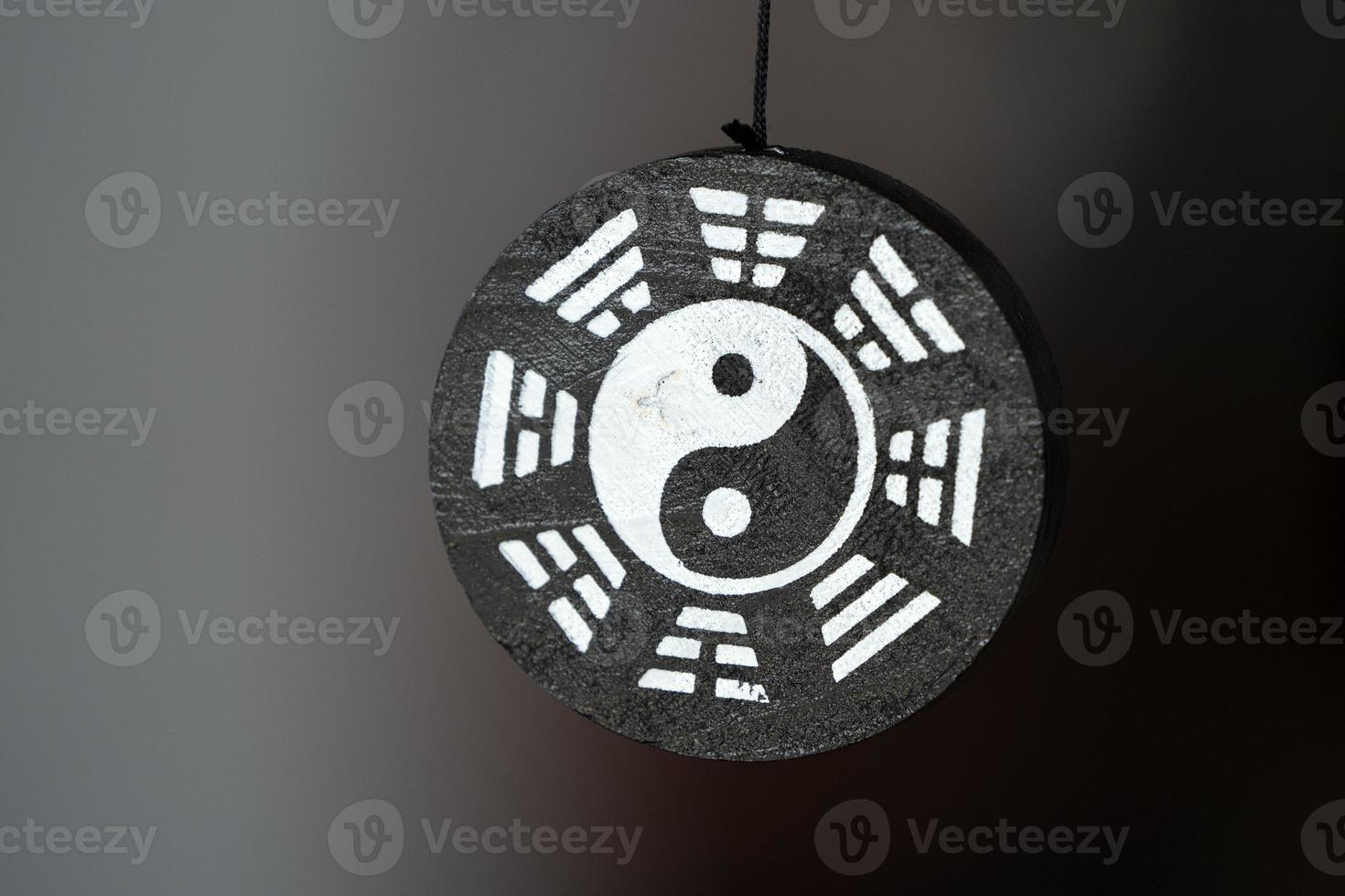 Yin Yang symbol pendant isolated photo