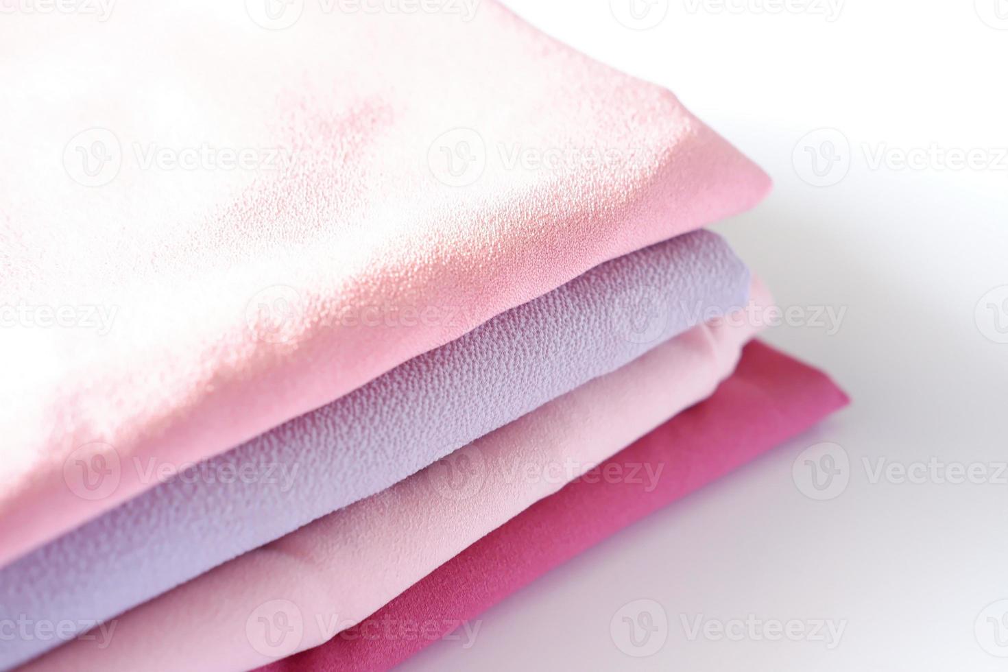 various beautiful and attractive fabrics folded neatly photo