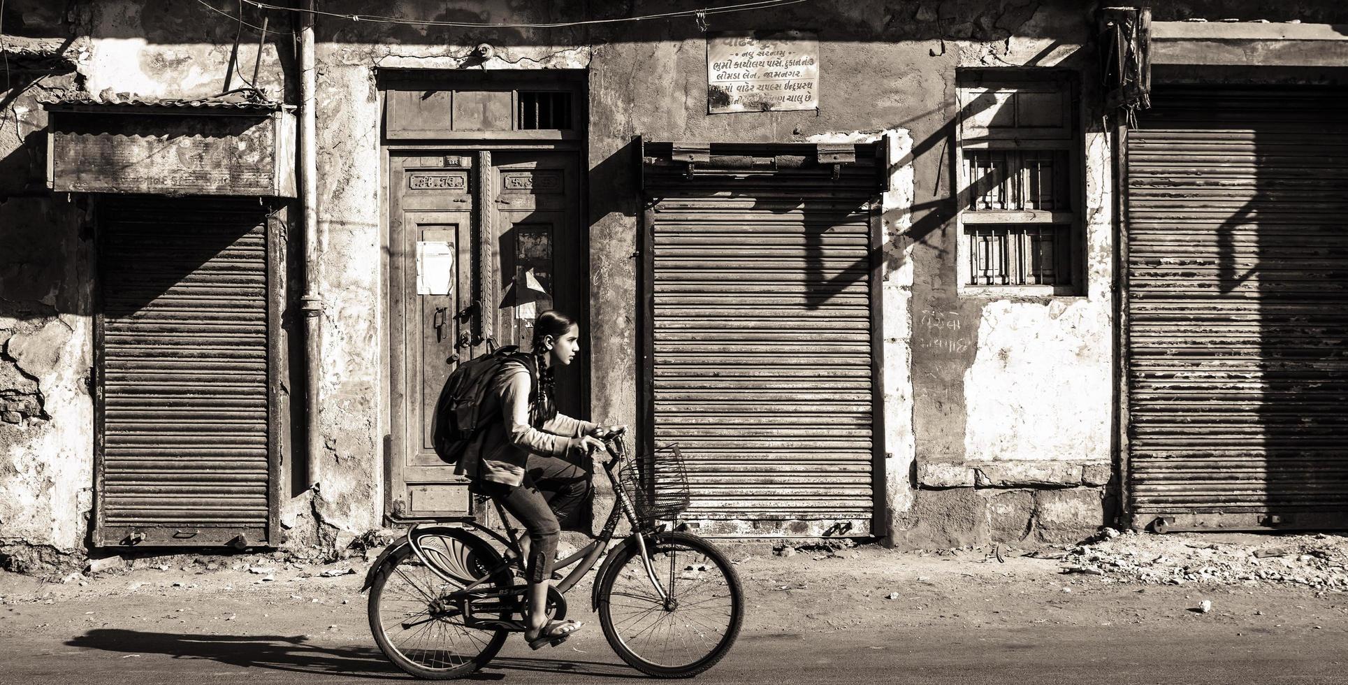 Jamnagar, India - December 2019. An Indian girl riding a bicycle photo