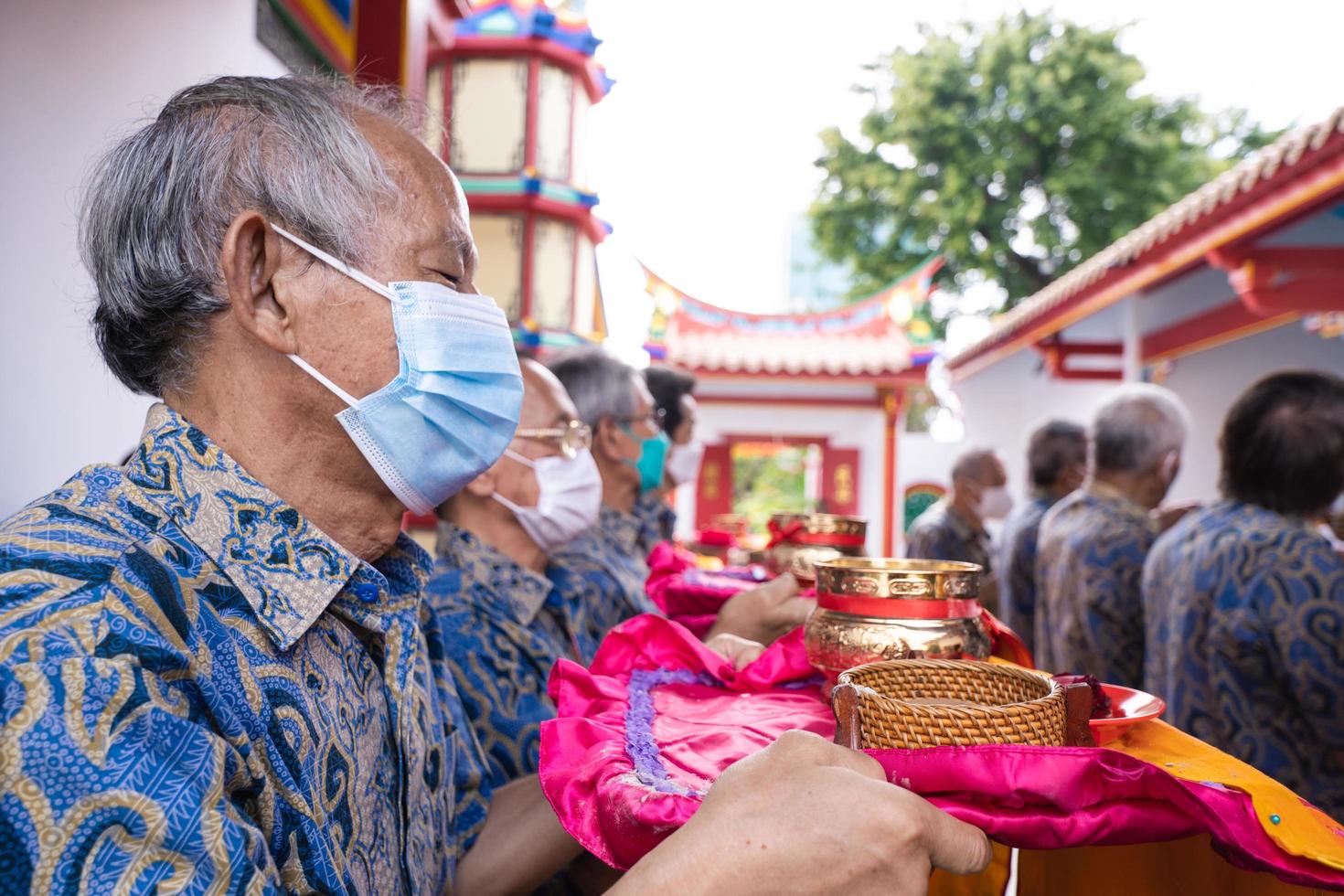 Bandung City, Indonesia, 2022 - Buddhist community praying together with the monks in front of the altar photo