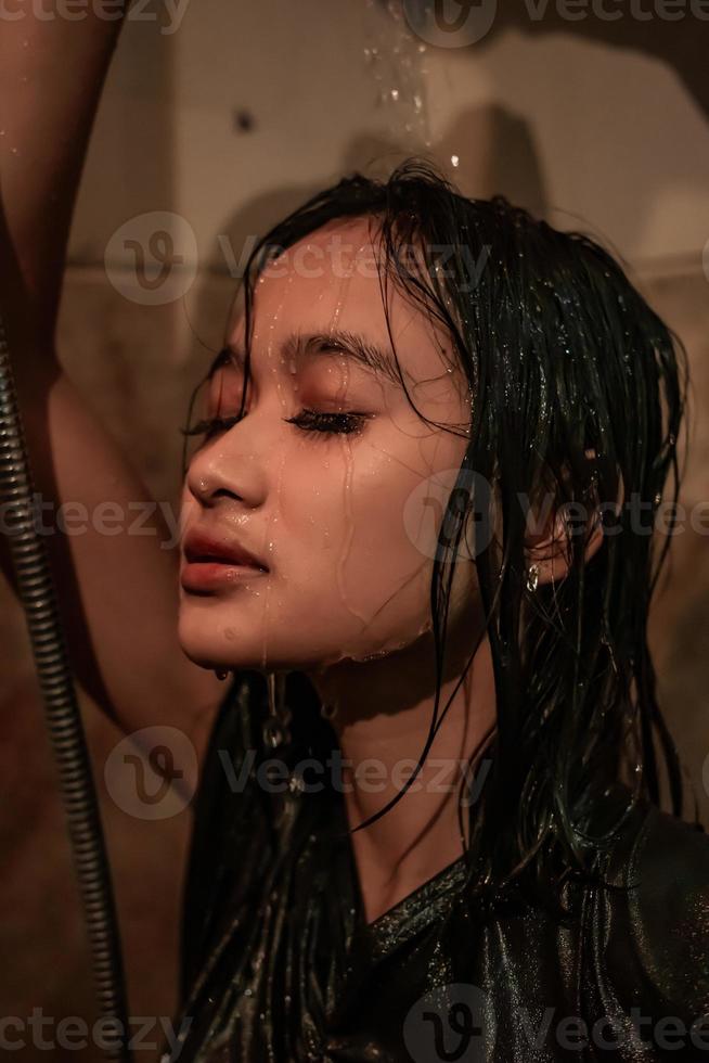 Anxiety women have a sad day while she showering her face with water