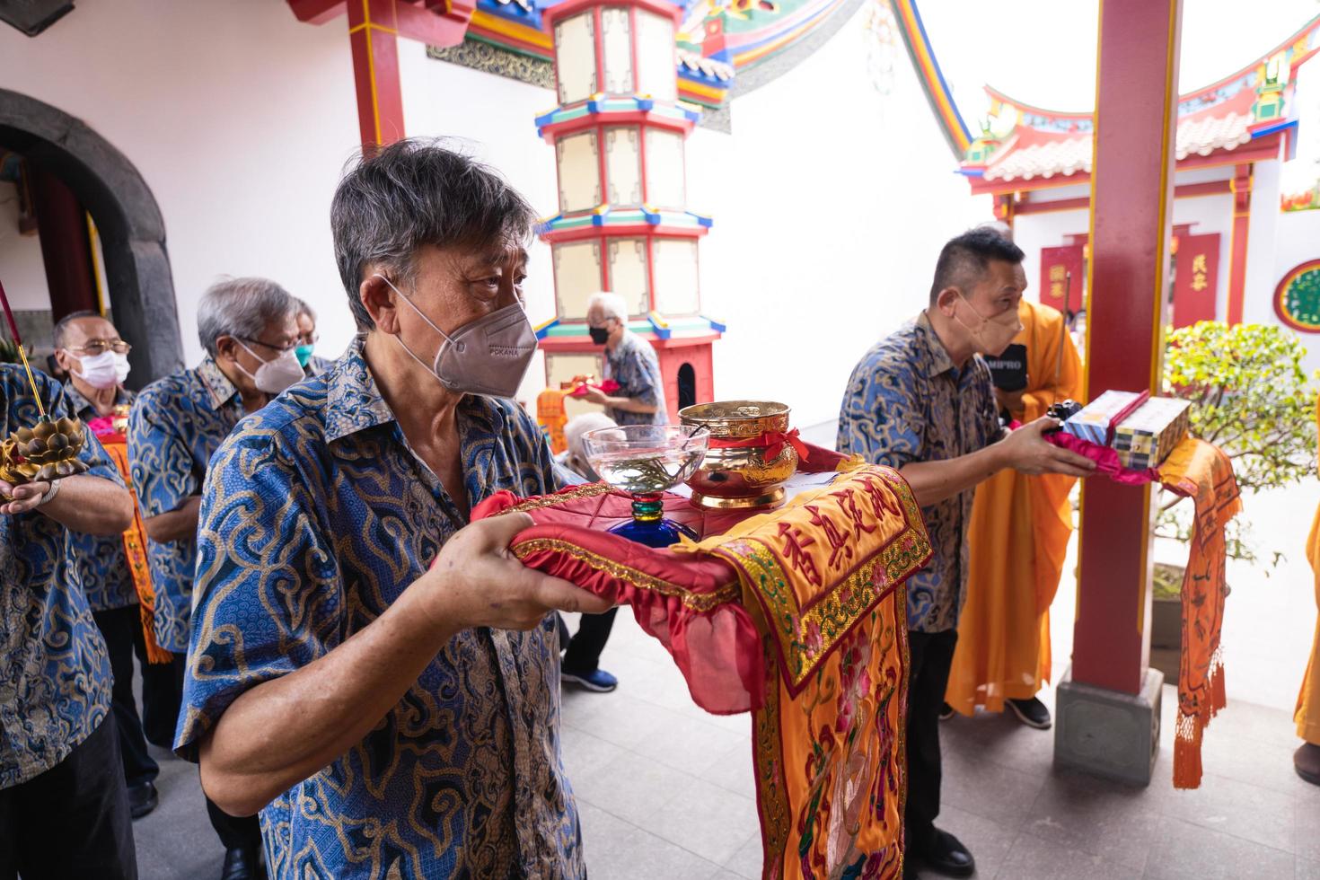 Bandung City, Indonesia, 2022 - Buddhist community praying together with the monks in front of the altar photo