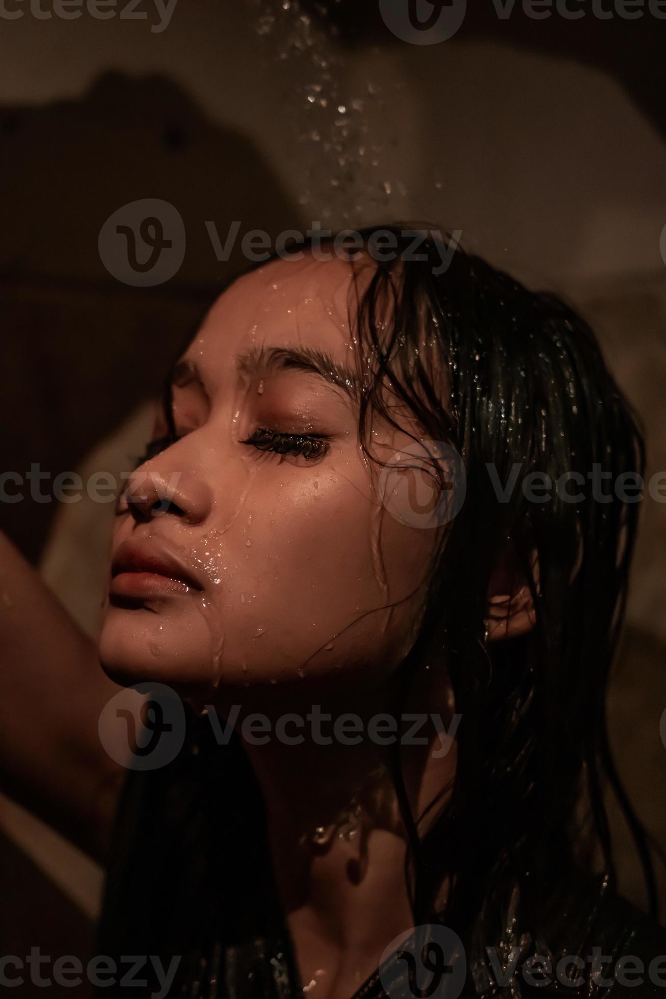 Anxiety women have a sad day while she showering her face with water