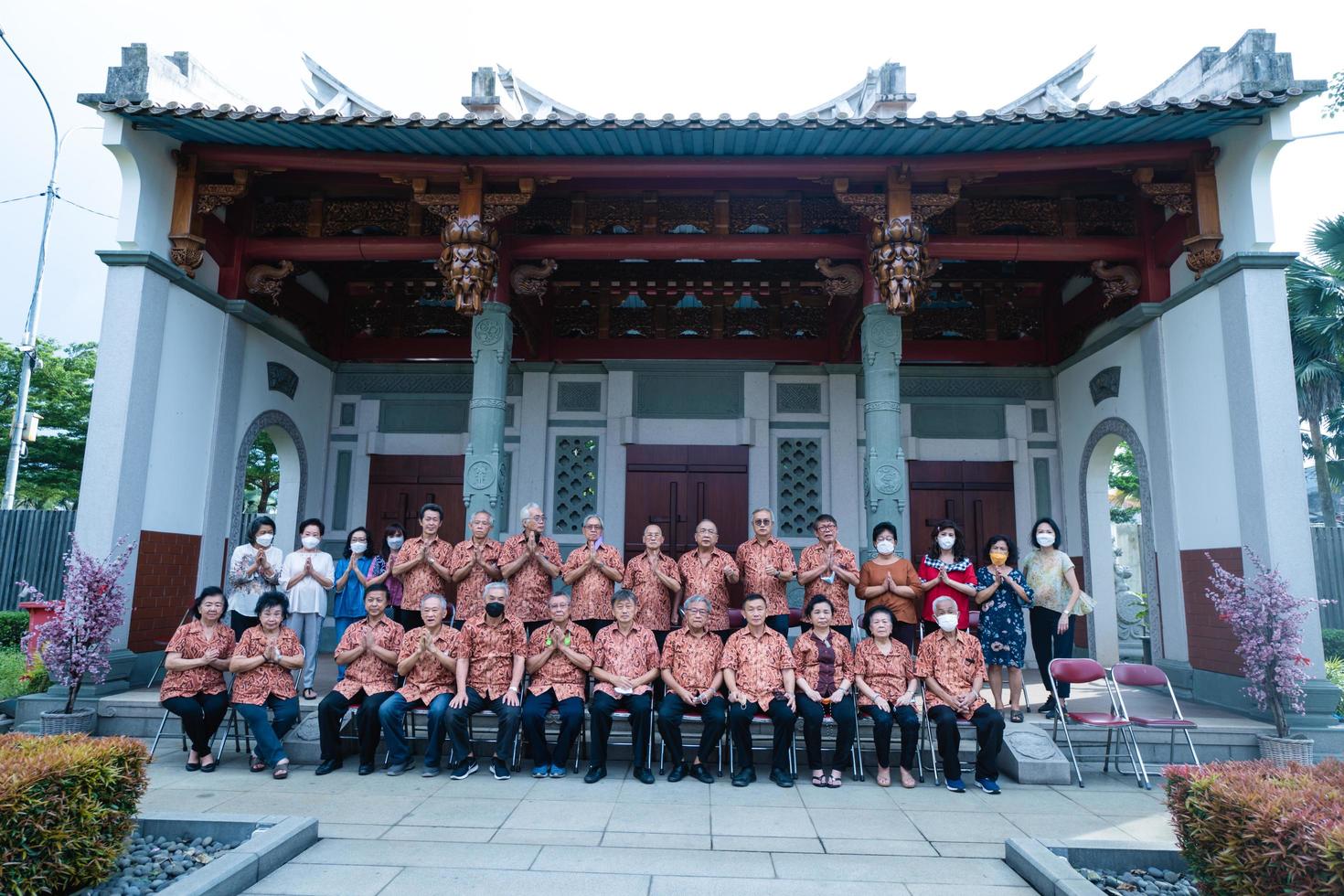 Bandung City, Indonesia, 2022 - The monks sitting together for taking a photo in front of the Chinese gate