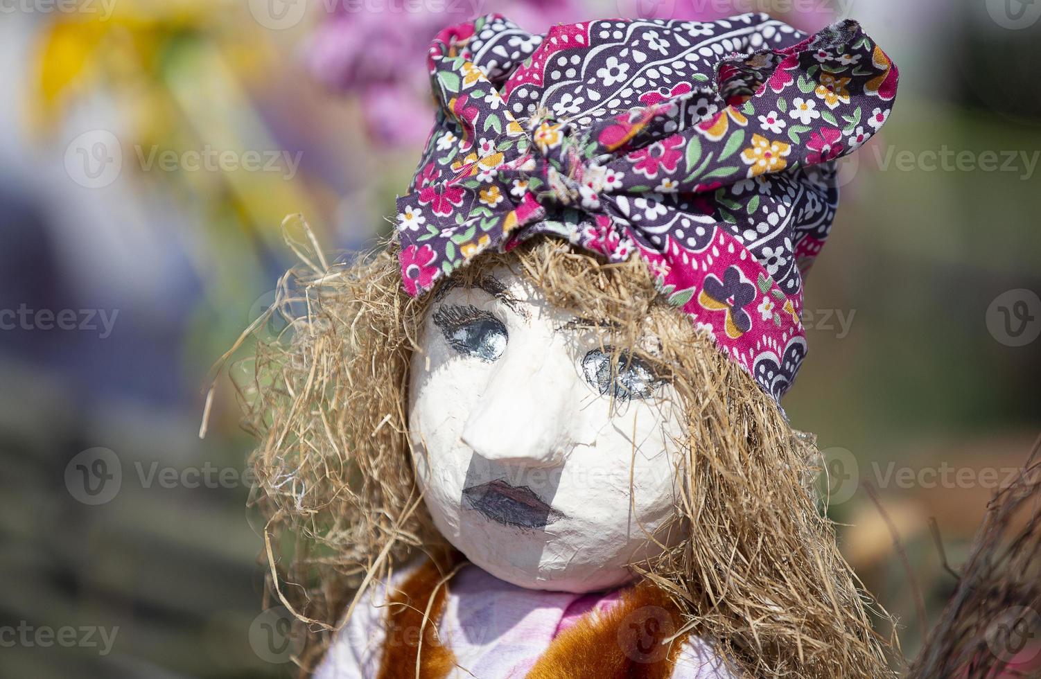 Sewing crafts. Traditional ethnic handmade cloth doll. Doll with straw hair. photo