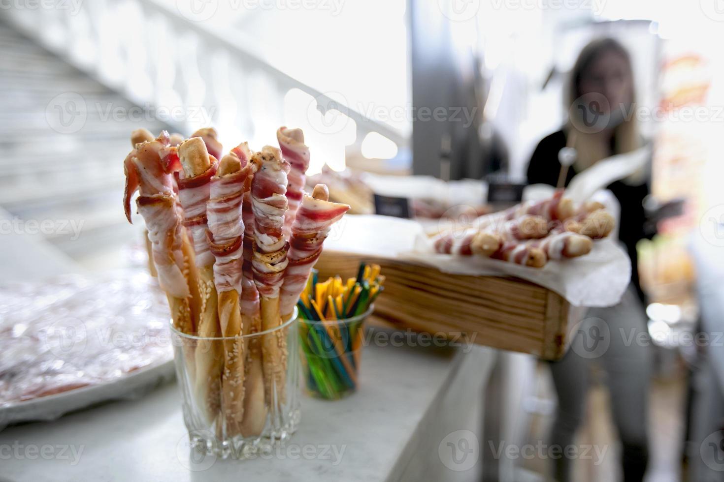 Meat appetizer for a buffet table against the background of a blurred hall. photo