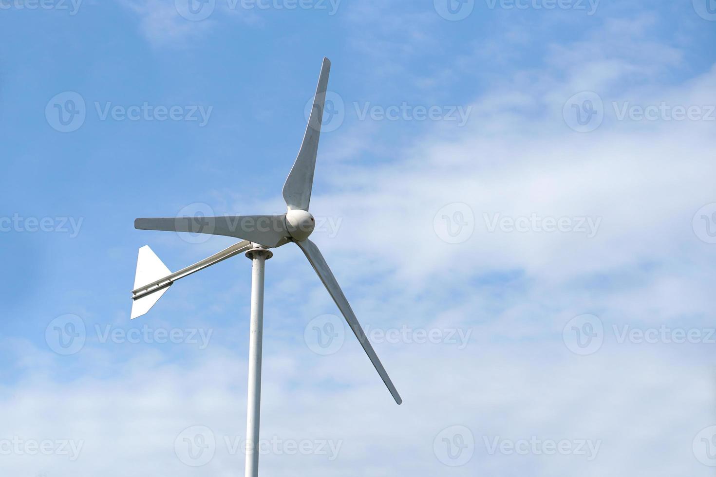 Wind Turbine Generating Electricity Blue Sky Background photo