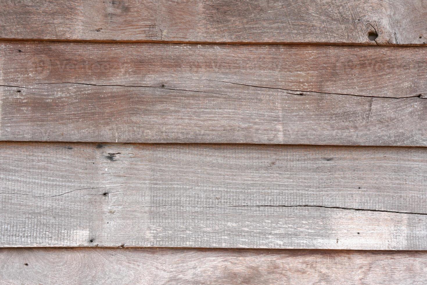 Old wooden background with cracks from time gone by. photo