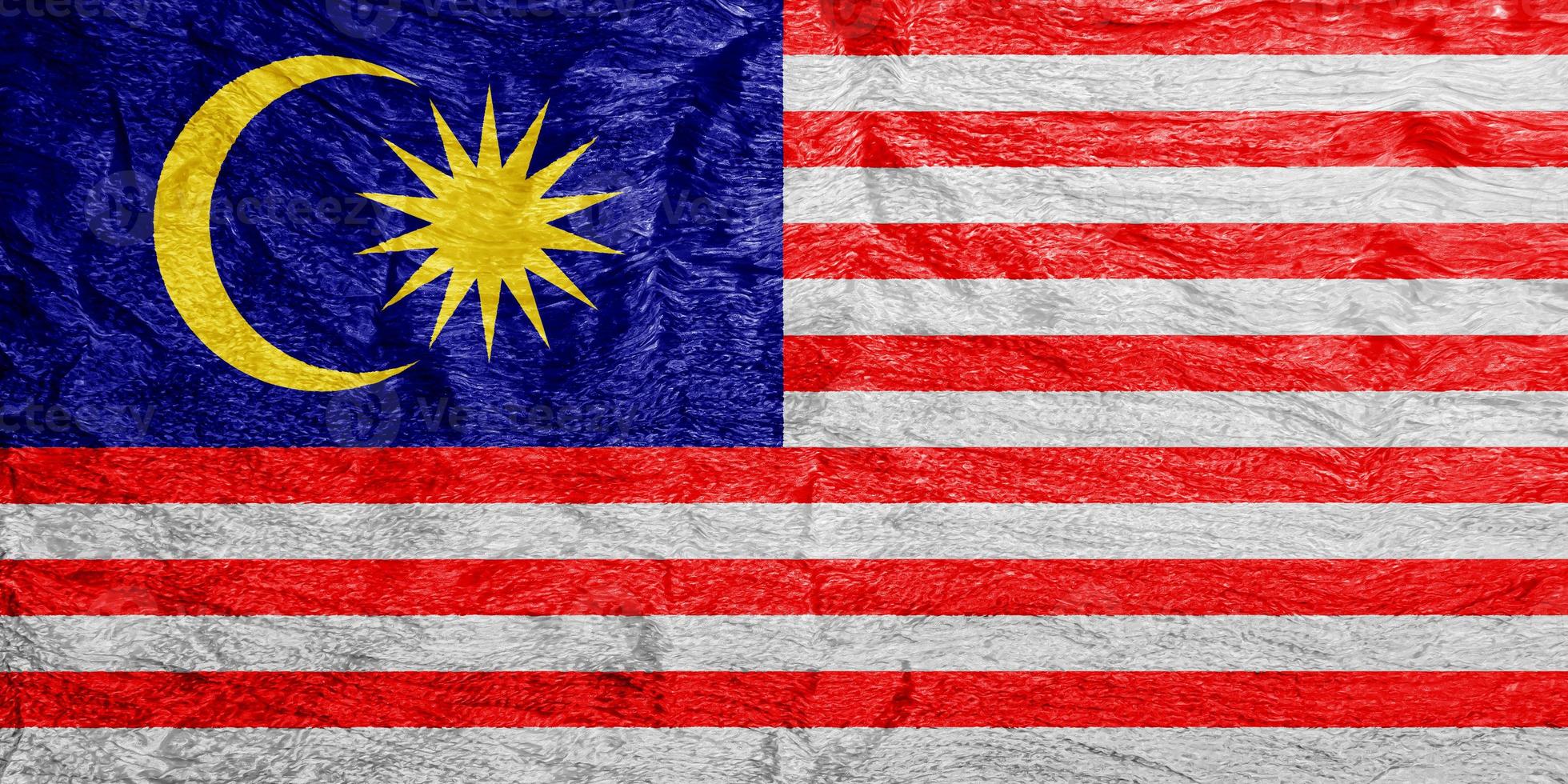 Malaysian flag on a textured background. Concept collage. photo