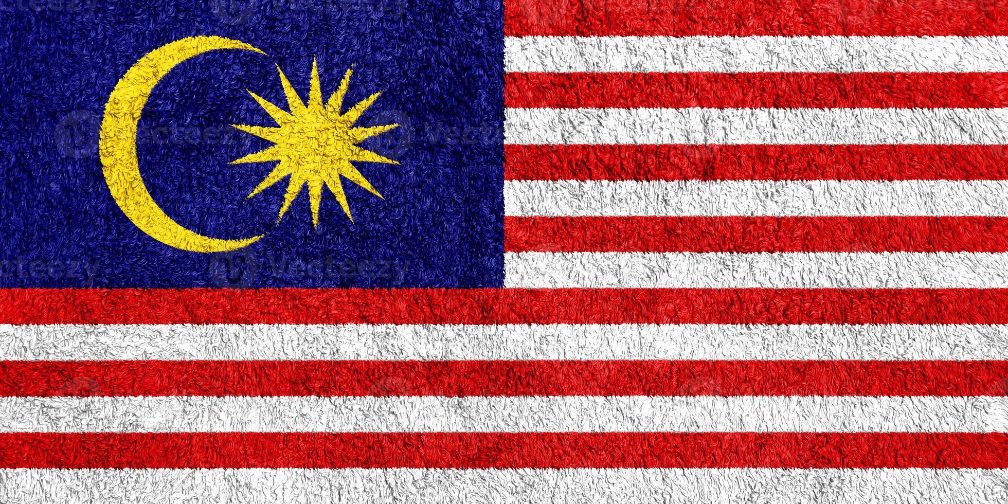 Malaysian flag on a textured background. Concept collage. photo