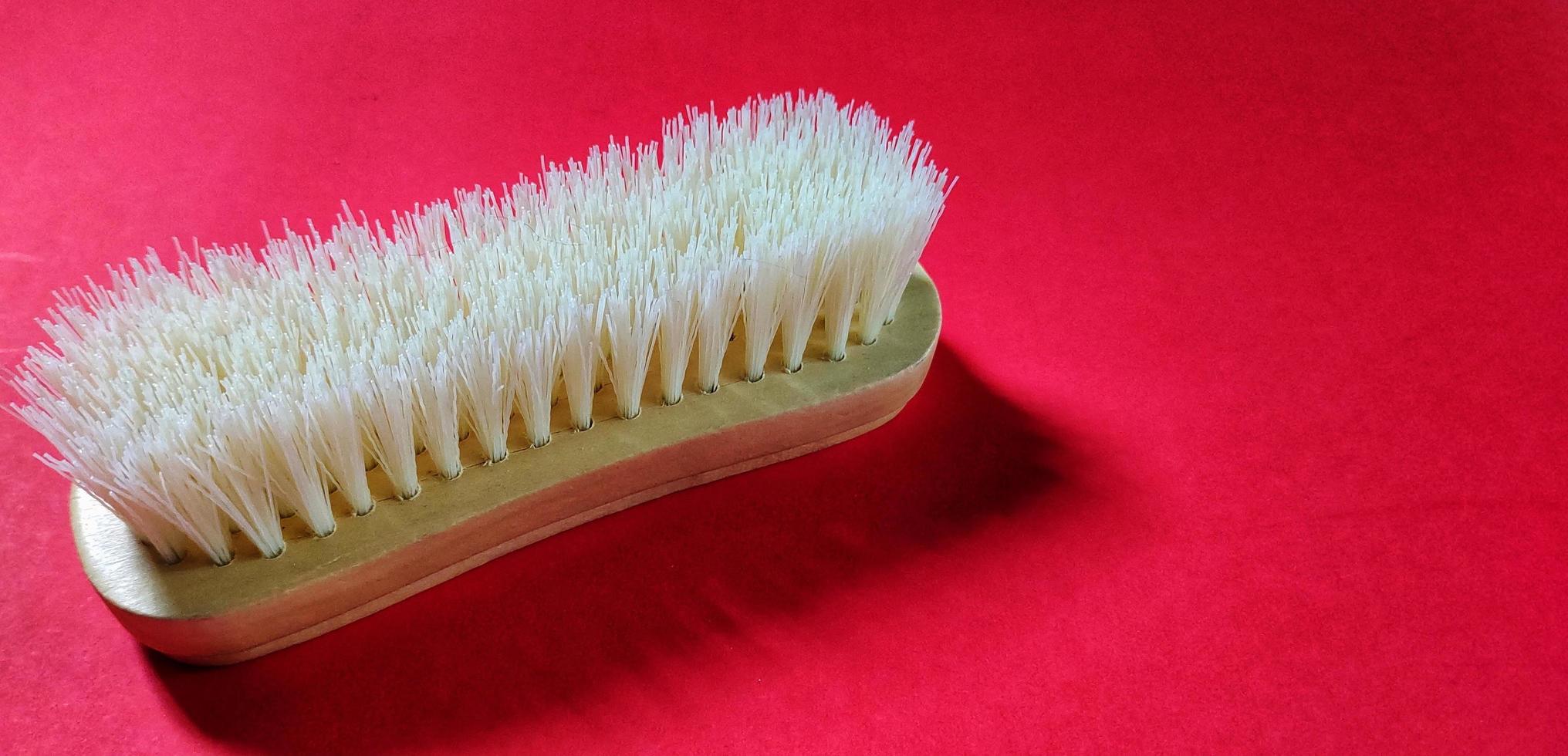 Close up view of white clothes brush photo