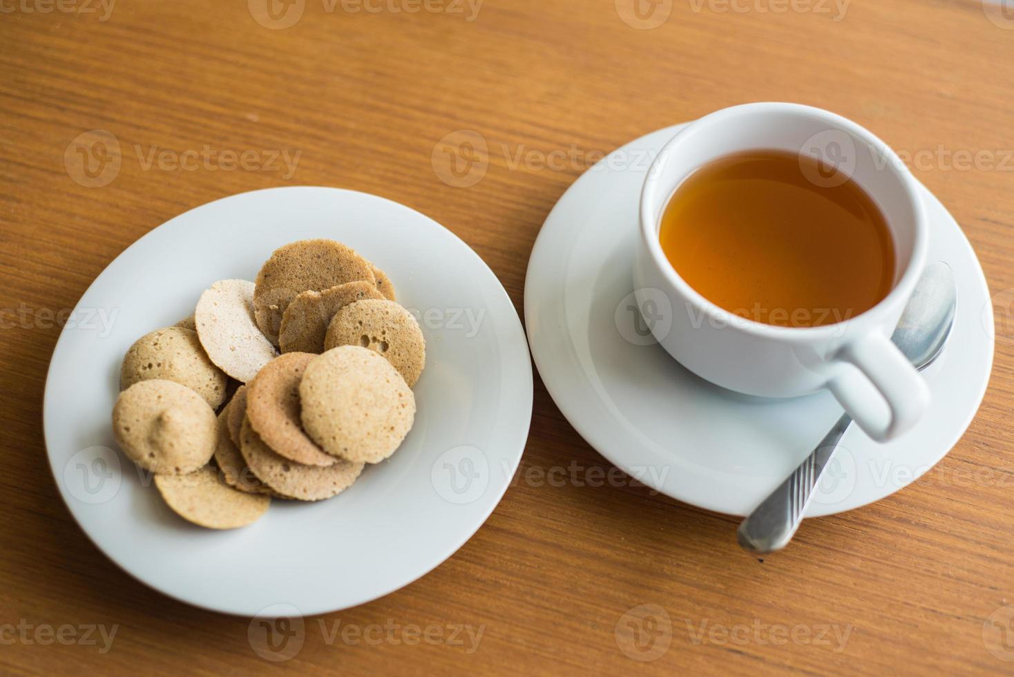 Afternoon Tea and Banana and Rice Berry Crispy on the wooden table photo