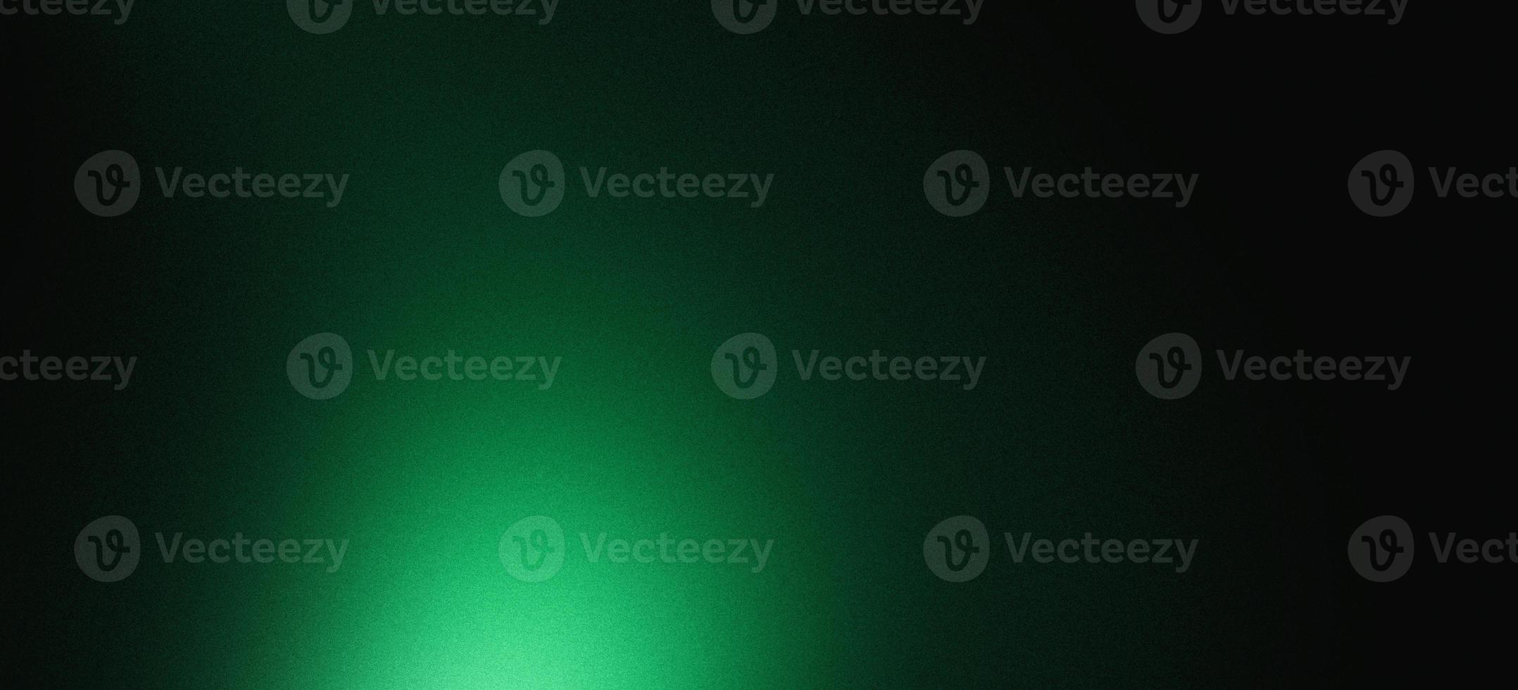 Dark green color gradient grainy background, illuminated spot on black, noise texture effect, wide banner size photo