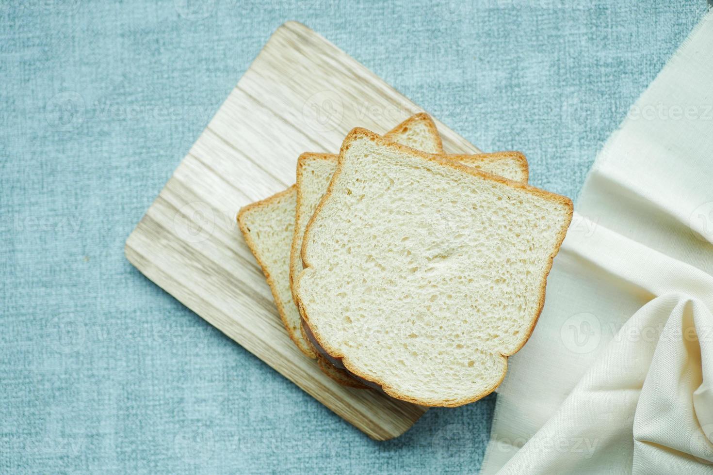 close up of stack of baked bread on table photo