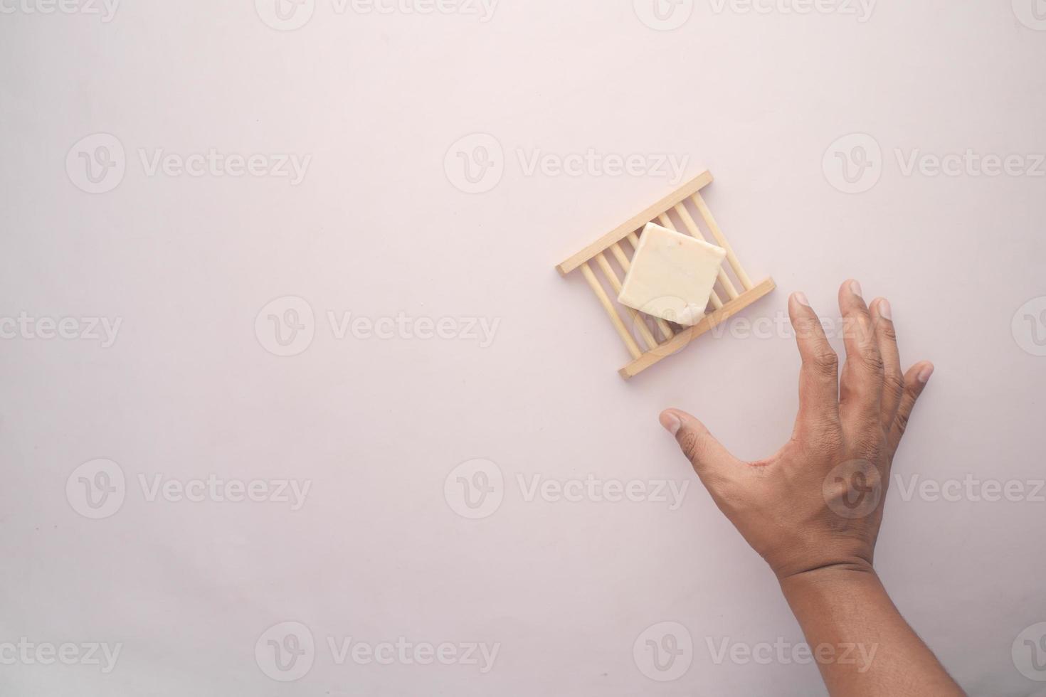 Homemade natural soap bar on black background photo