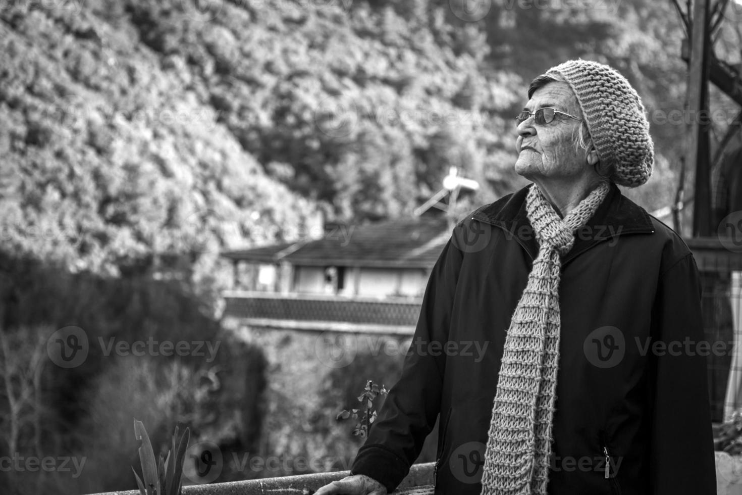 Portrait of an old Woman with a knitted cap and scarf photo