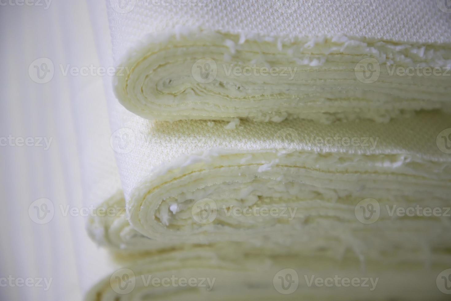 Close-up focus folded stacked sherpa fabric backdrop pattern textured  can be used as a background wallpaper photo