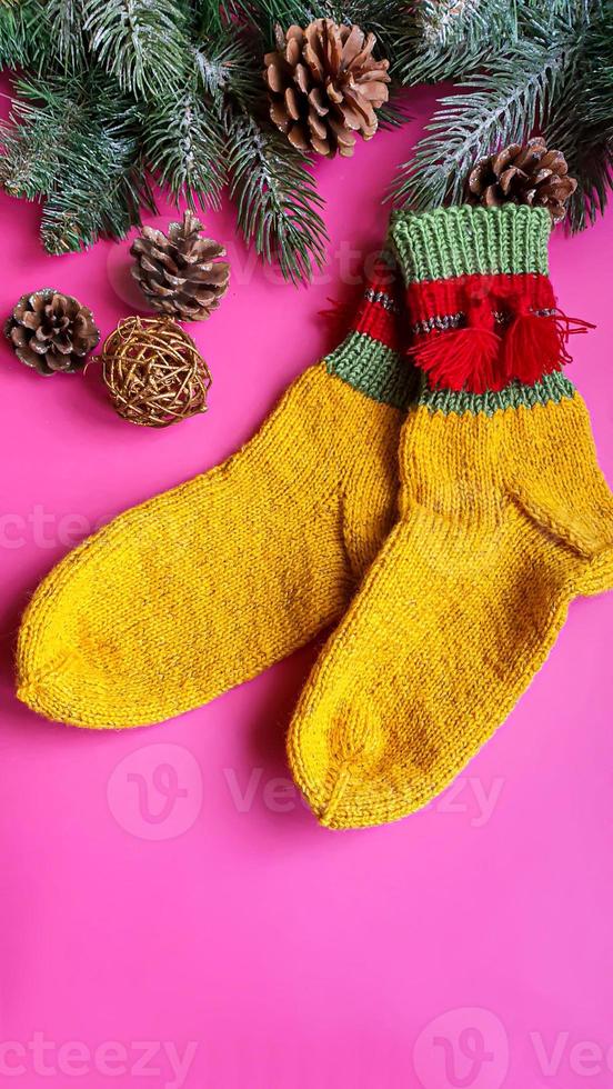 Knitted handmade items. Knitted fabric from colored thread. Bright background. photo