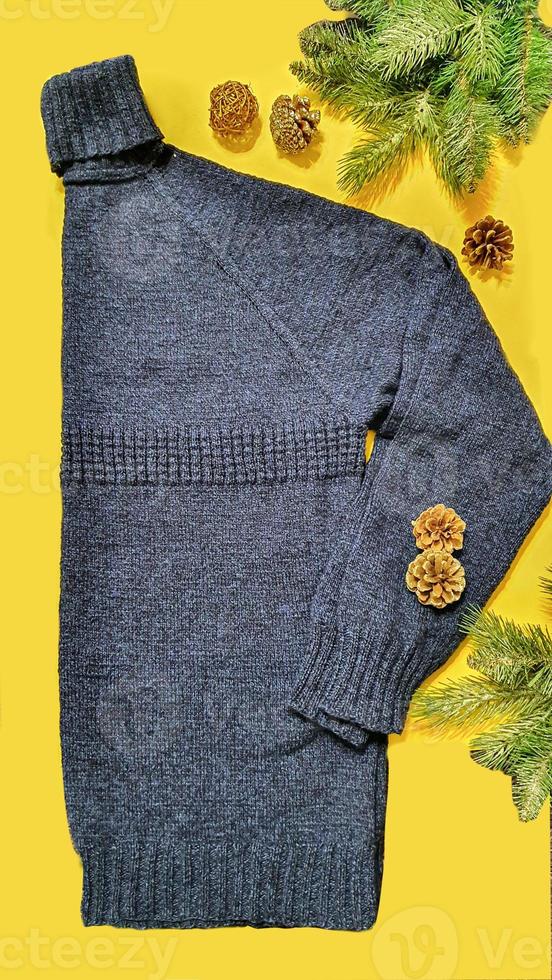 Knitted handmade items. Knitted fabric from colored thread. Bright background. photo
