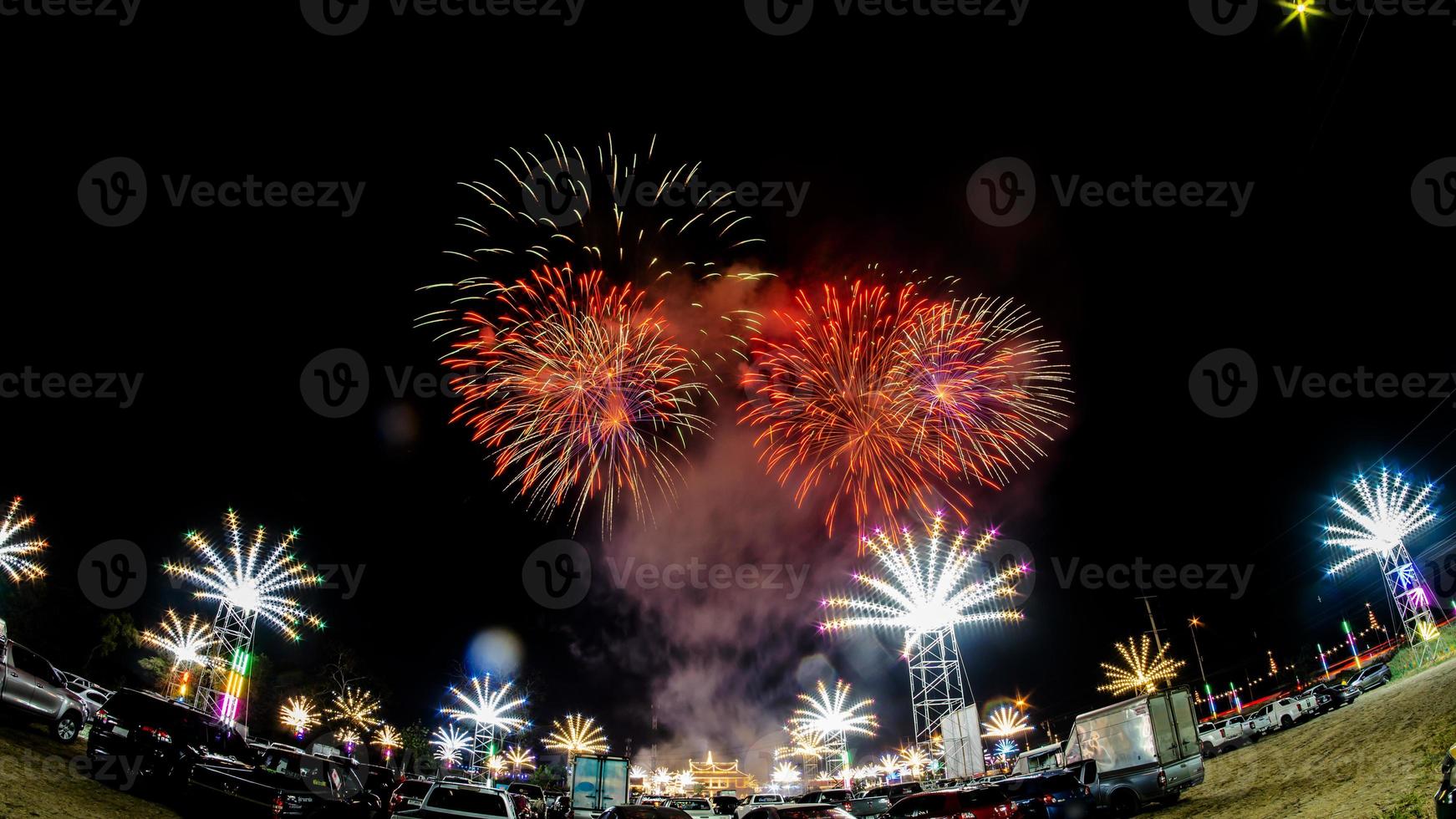 fireworks over the temple in the dark sky photo