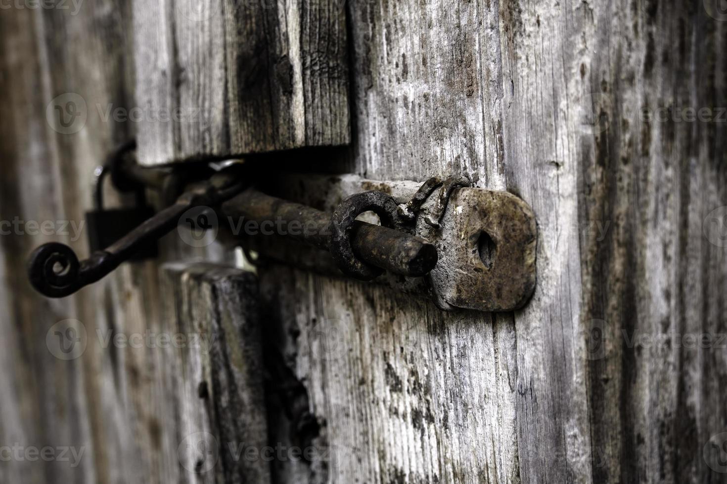 Closed padlock on a door photo