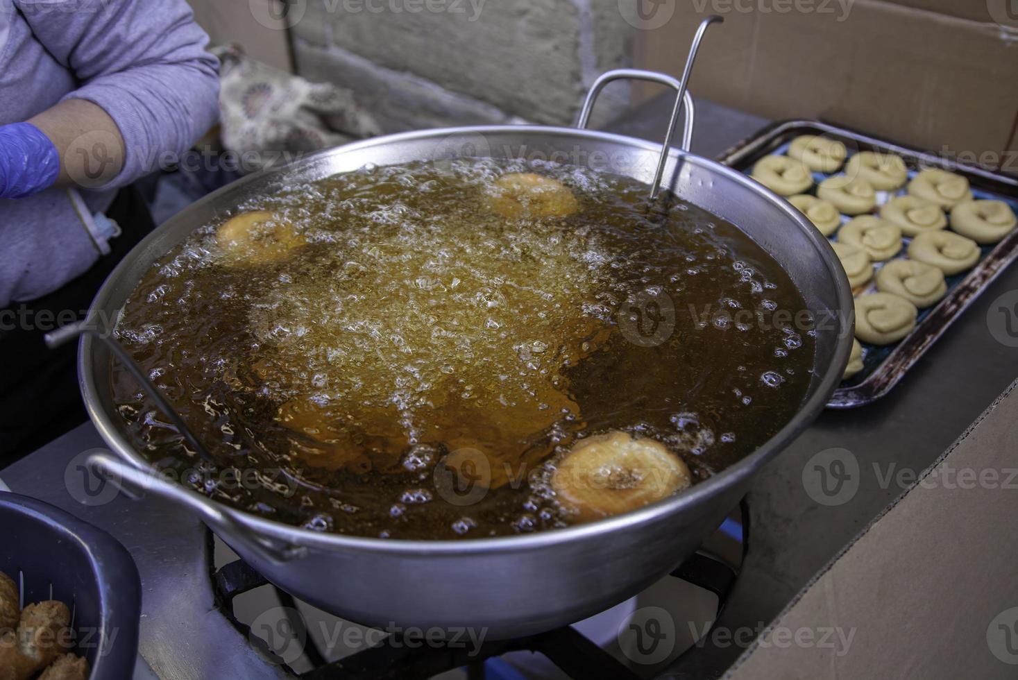 Frying donuts in a market photo