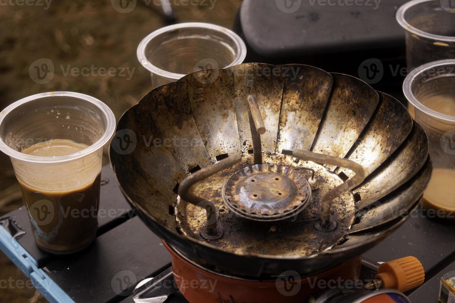 coffee and rusty camping stove photo