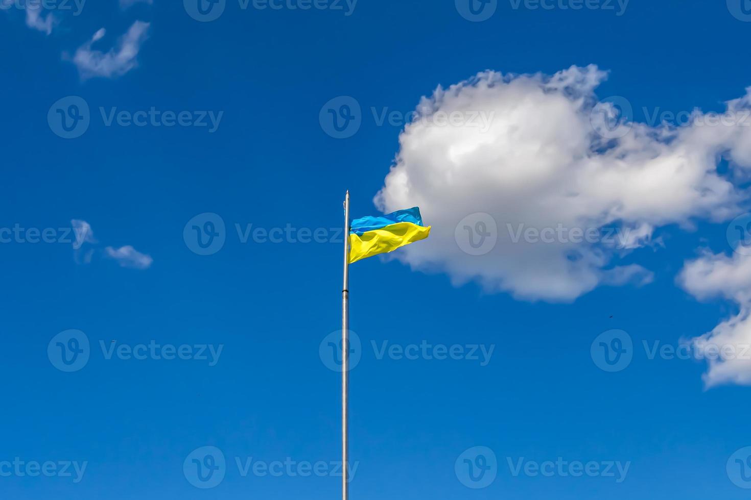 Photography on theme national Ukrainian flag in peaceful sky photo