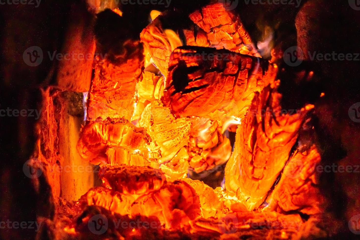 Beautiful old fireplace with light flame fire for heating building room photo
