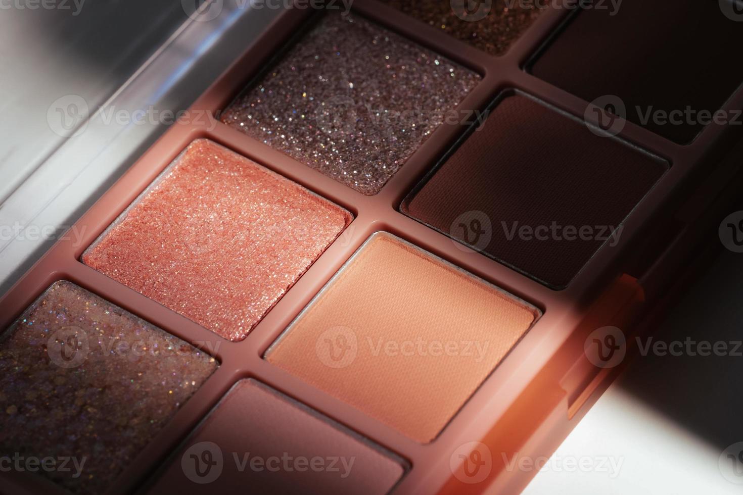 Eyeshadow palette in shadow and light photo