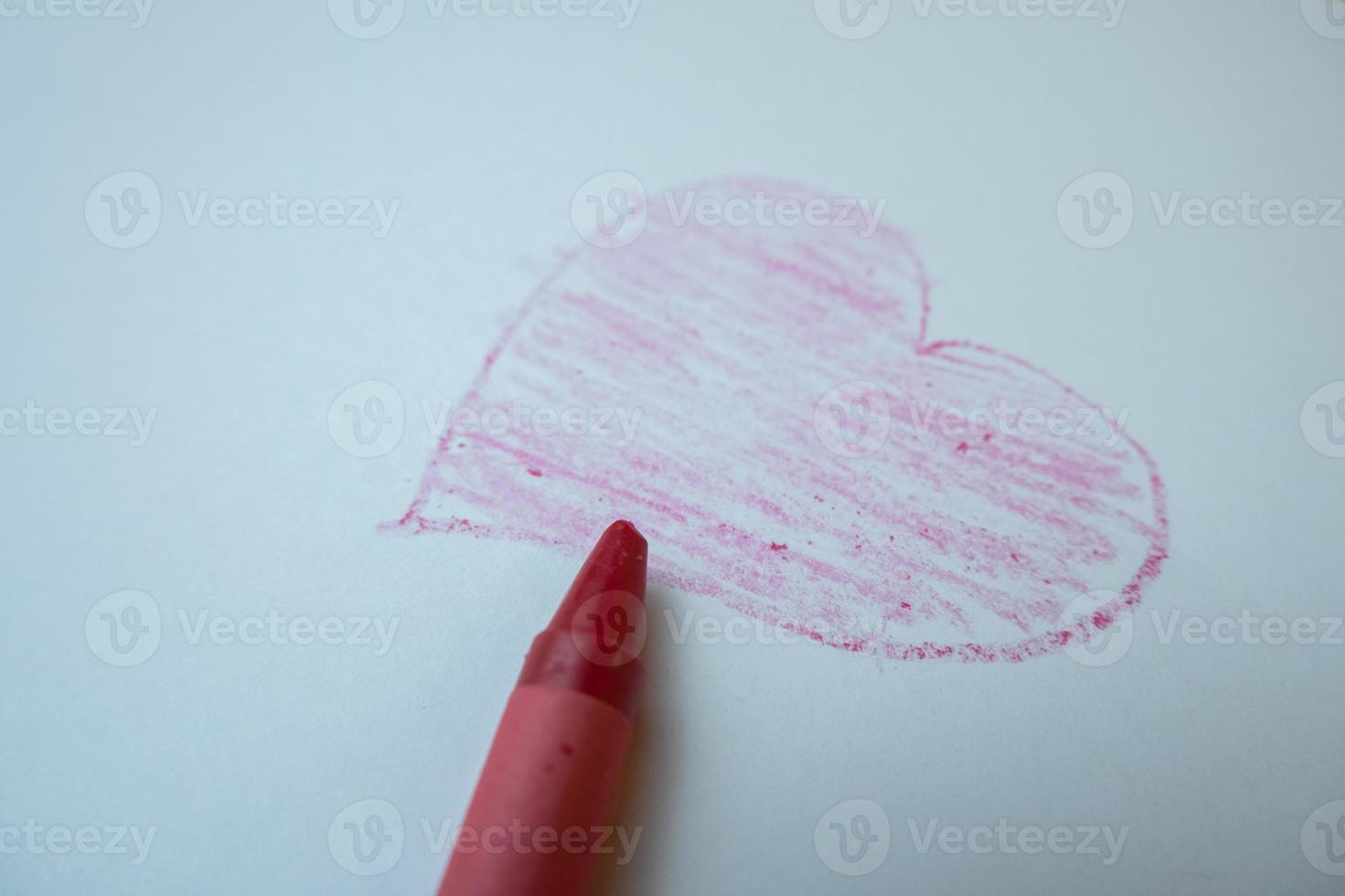 selective focus on the love symbol drawn by hand using colored pencils, soft focus photo