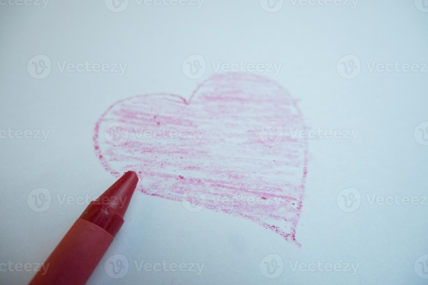selective focus on the love symbol drawn by hand using colored pencils, soft focus photo