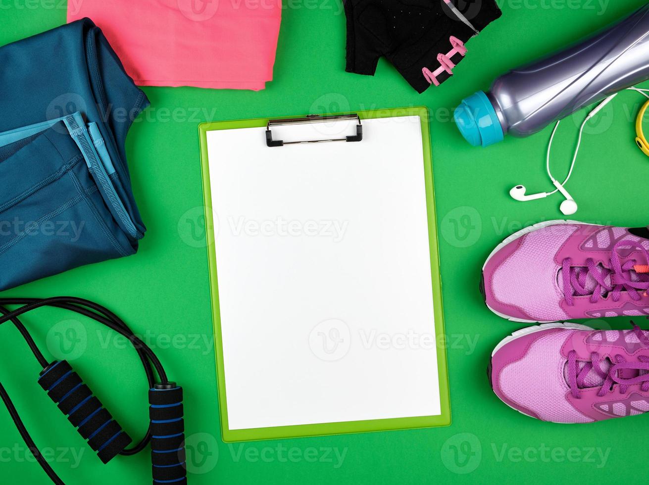 sports women's clothing for sports and fitness, green background photo