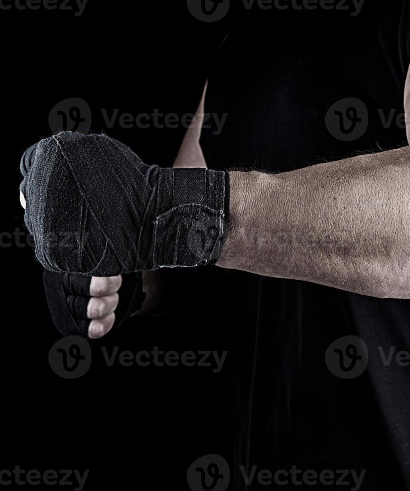 athlete is standing with a stretched arm bandaged photo