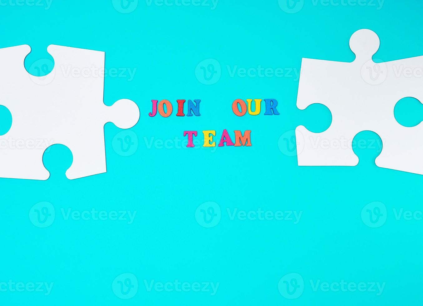 paper blank white puzzle on a blue background, inscription join our team photo