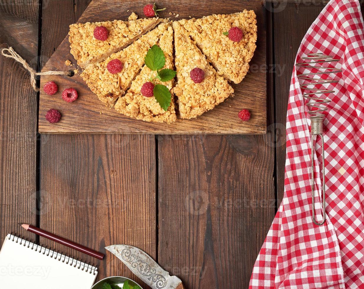 sliced triangular pieces of crumble pie with apples photo