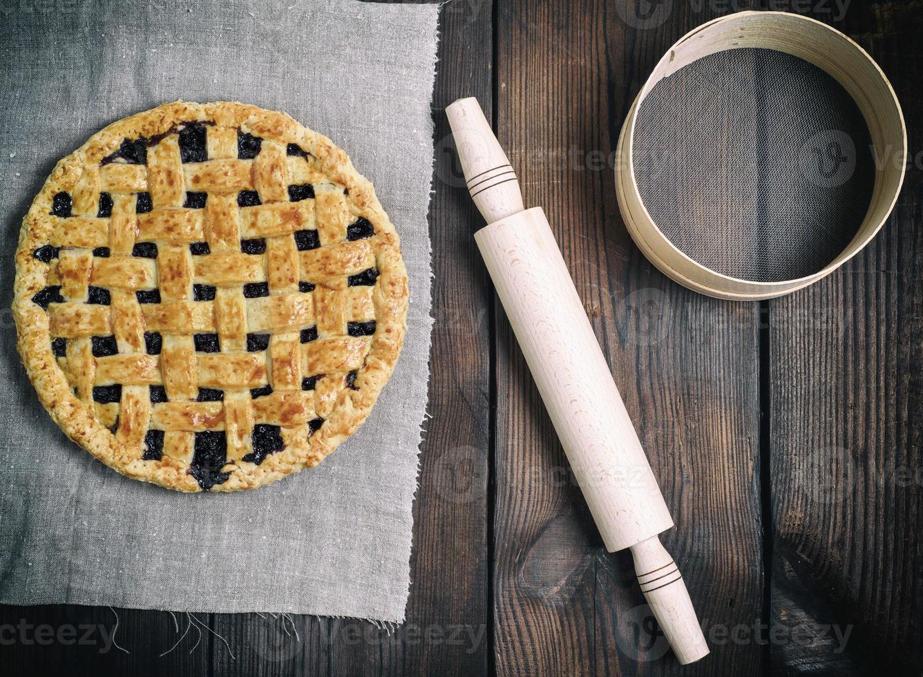 round baked fruit cake on a gray napkin photo