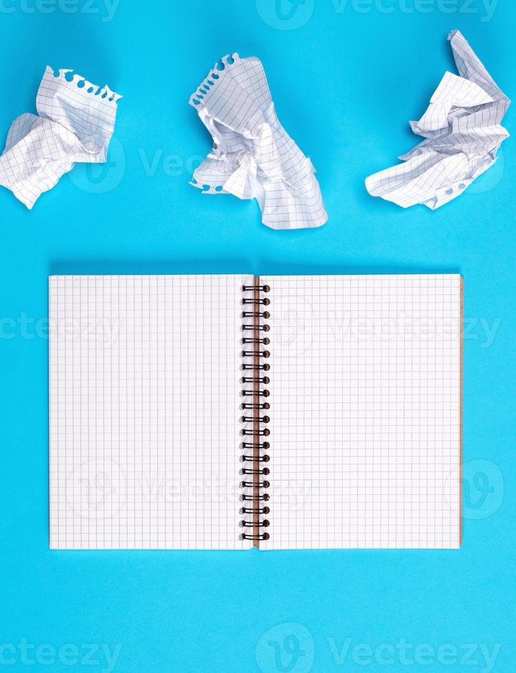 open  blank notebook with white sheets photo